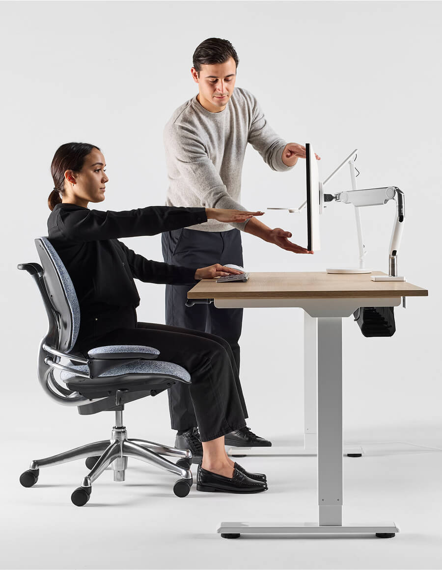 woman having a workstation assessment completed